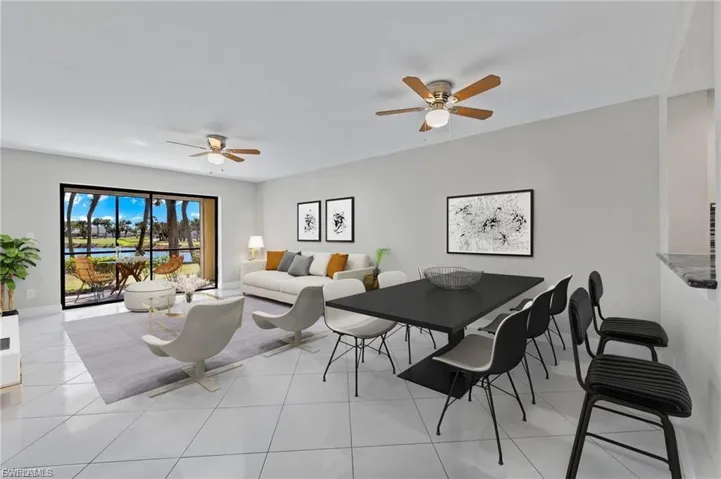 Dining room with light tile patterned flooring and ceiling fan
