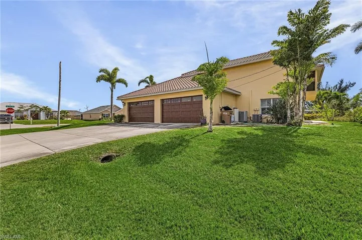 View of front of house featuring a 4-car garage!