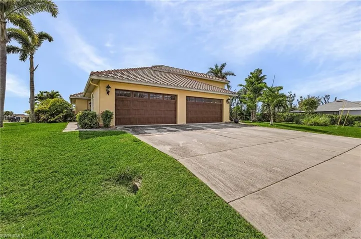 View of front facade with a 4-car garage!