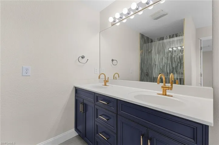 Master bathroom featuring vanity and separate shower