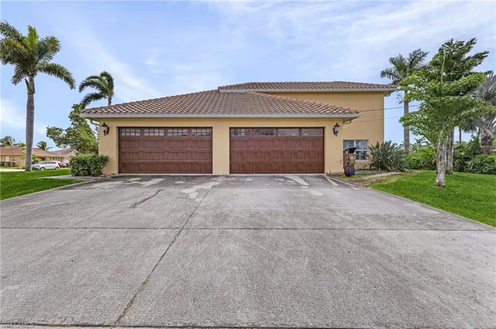 Extra wide driveway and 4 car garage!