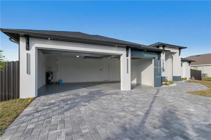 View of property exterior with a garage