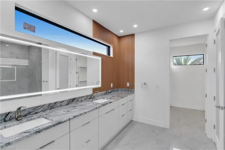 Bathroom with an enclosed shower and vanity