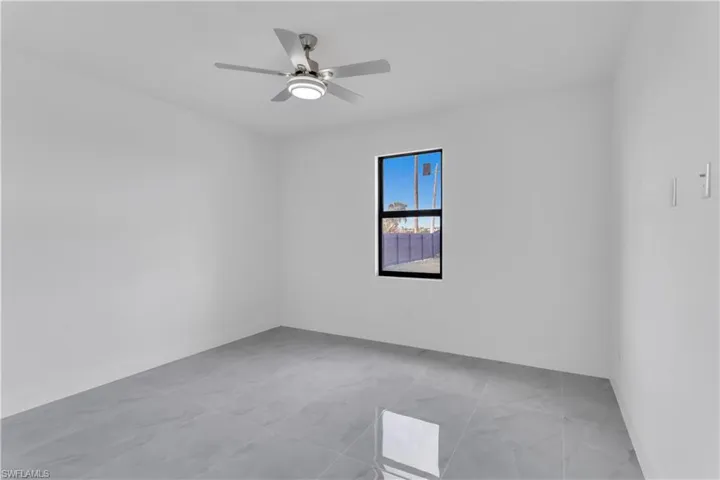 Empty room featuring ceiling fan