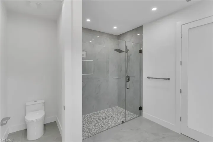 Bathroom with toilet and walk in shower