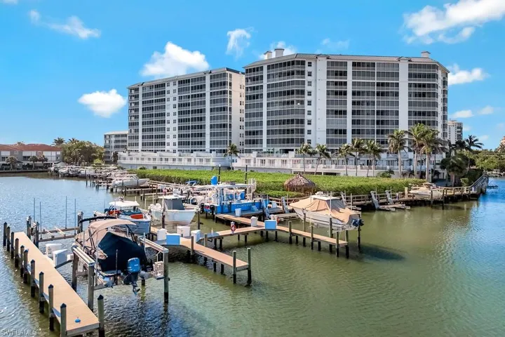Dock area with a water view and boat lift