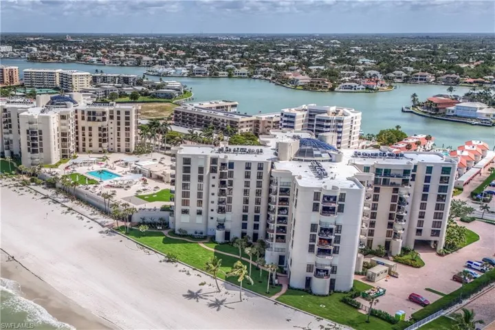 Birds eye view of property with a water view and a city view