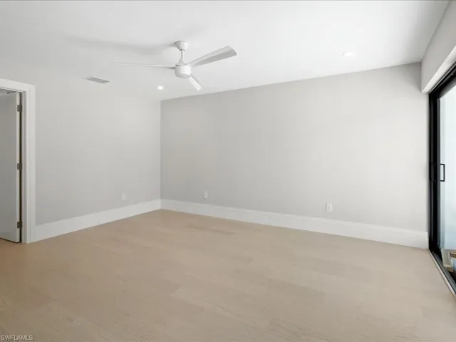 Master Bedroom with visible vents, baseboards, light wood-style floors, and ceiling fan