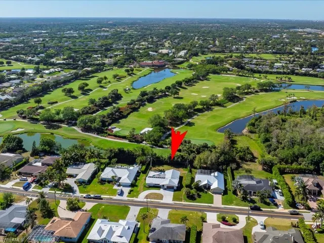 Aerial view featuring a residential view, a water view, and golf course view