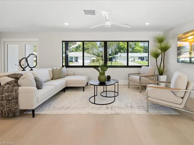 Living room featuring a ceiling fan, recessed lighting, wood finished floors, and visible vents