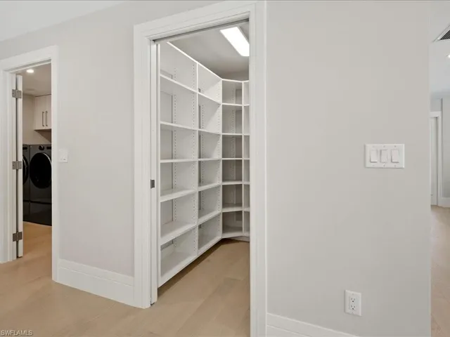 Pantry with washer and clothes dryer
