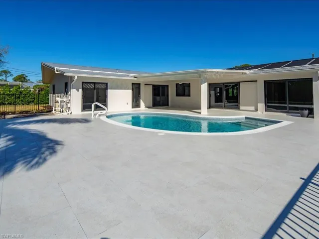 View of pool featuring a patio area, a fenced in pool, and fence