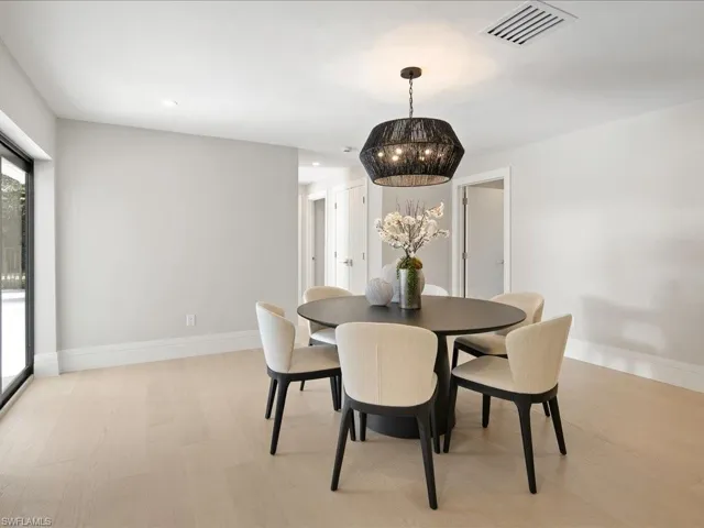 Dining area featuring recessed lighting, baseboards, visible vents, and light wood-type flooring
