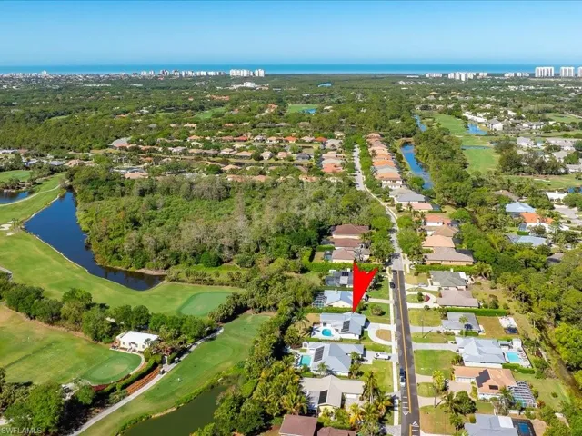 Bird's eye view with a residential view, view of golf course, and a water view
