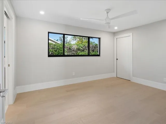 Unfurnished room with light wood-style flooring, recessed lighting, baseboards, and ceiling fan