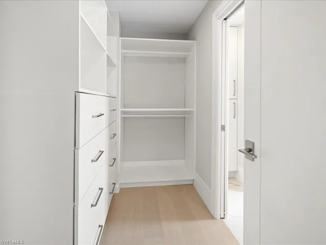 Walk in closet featuring light wood-type flooring