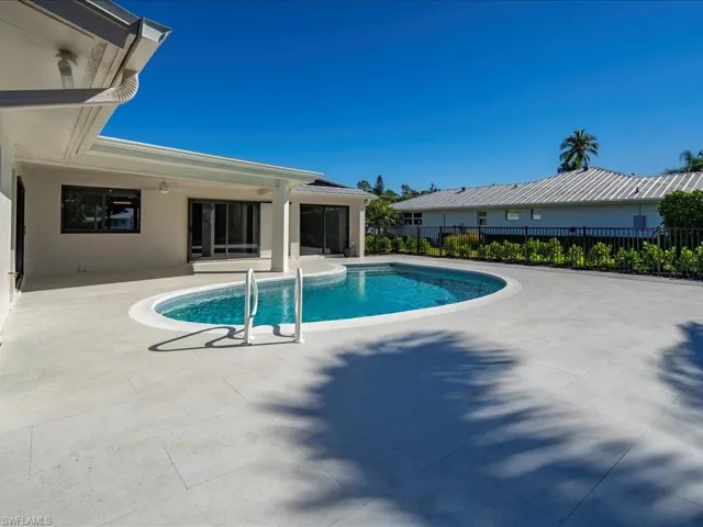 View of pool with a fenced in pool, a patio, and fence