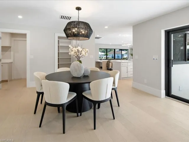 Dining space with recessed lighting, visible vents, a chandelier, and light wood finished floors