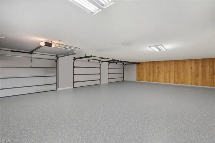 Garage featuring a garage door opener