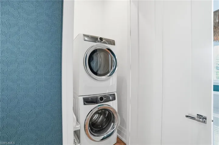 Space-smart laundry closet featuring Electrolux W & D, designed for effortless living in the privacy of the Master suite