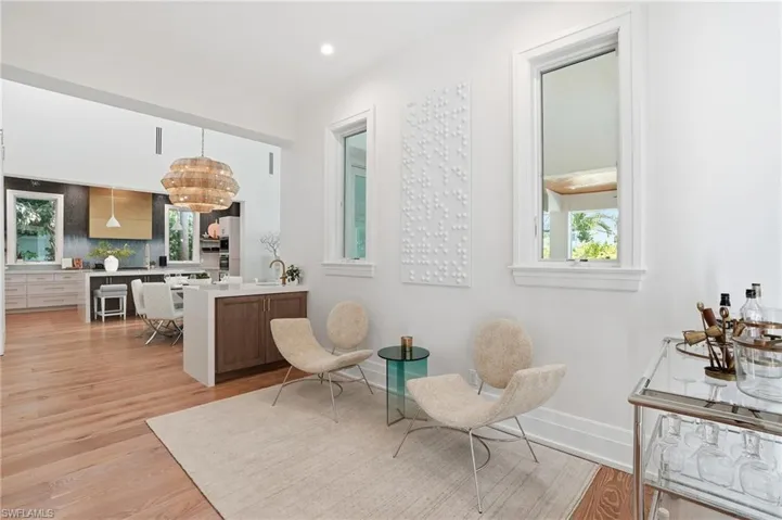 The parlor area features a wet bar and a conversation area