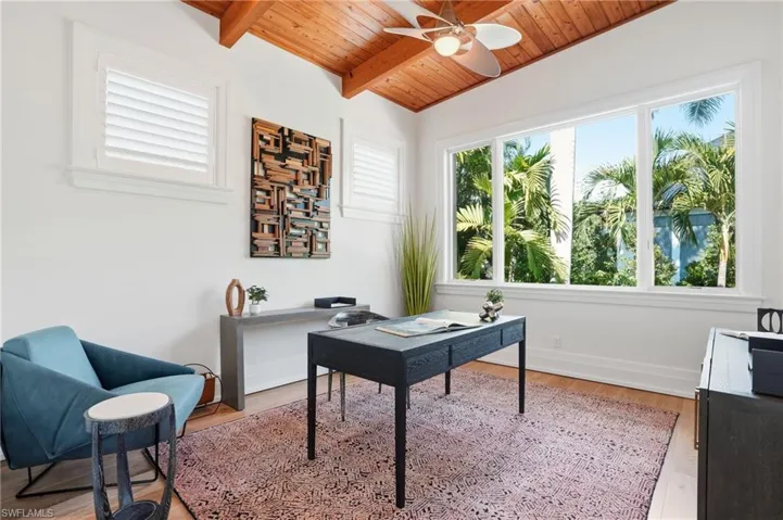 An inspiring workspace with soaring wood ceilings, serene views, and flexible use for a 4th bedroom or an office