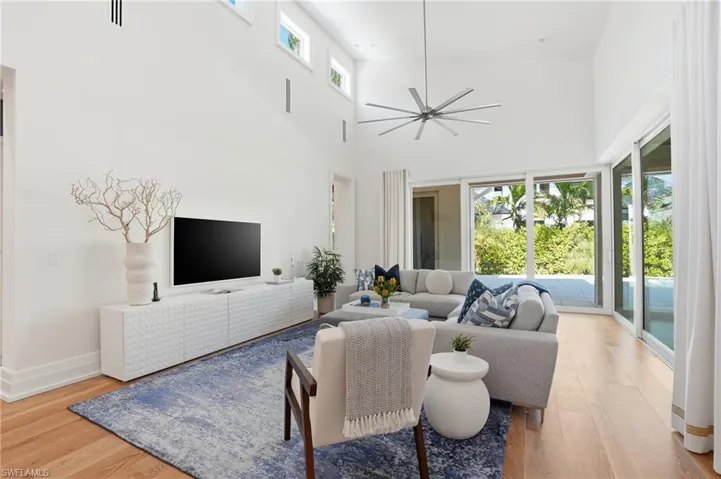 Light-filled comfort for everyday living with walls of glass opening to the pool terrace and outdoor lounge