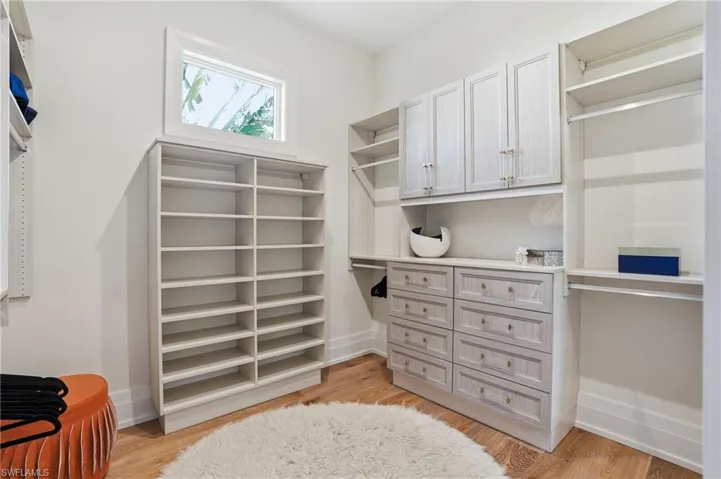 1 of 2 Custom closets in the Primary Suite