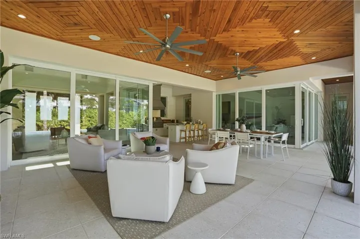 Enjoy almost 1000 sq.ft. of covered space under this stunning tongue and groove ceiling that features a private sitting area