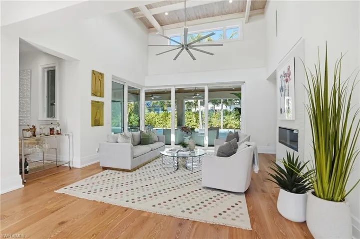 Enjoy soaring ceilings in this airy formal living space