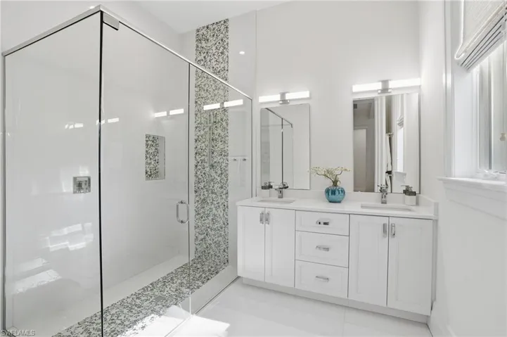 A beautifully appointed ensuite with clean contemporary lines and spa-worthy shower design