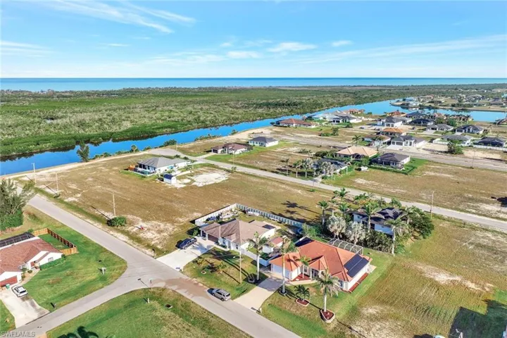 Aerial view with a water view and a residential view