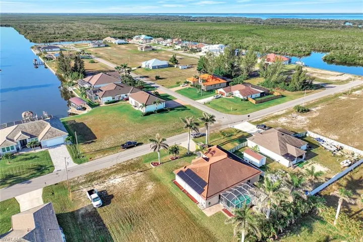Drone / aerial view featuring a residential view and a water view