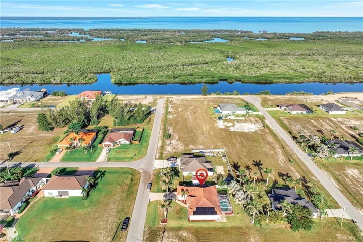 Drone / aerial view with a water view and a residential view