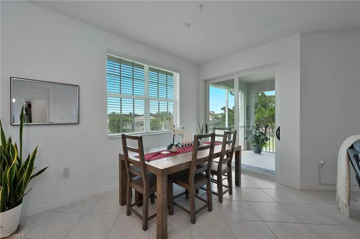 Breakfast Nook space featuring light tile patterned floors and baseboards