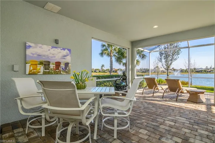 Sunroom / solarium with a water view