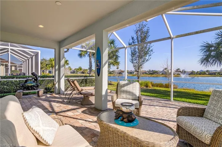 Sunroom / solarium with a water view