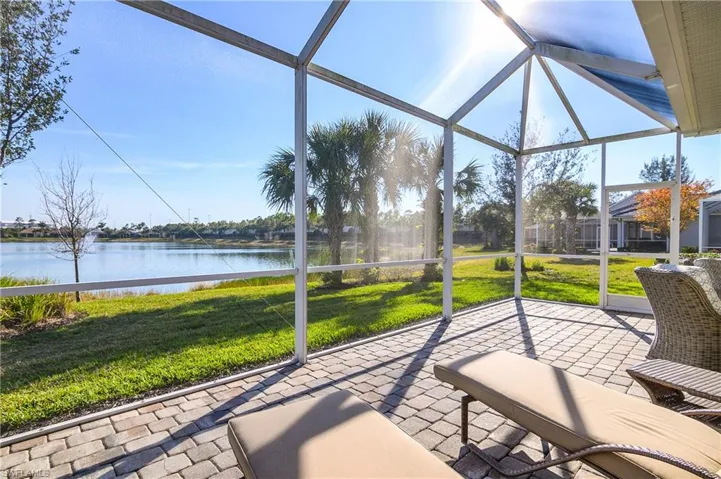 Unfurnished sunroom featuring a water view