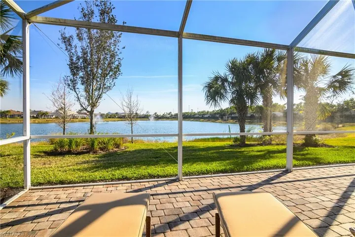 Unfurnished sunroom featuring a water view