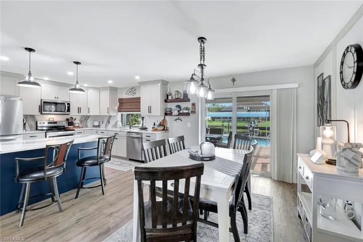 Dining space with light wood-style vinyl flooring
