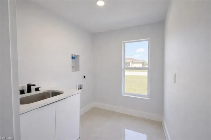 4531_Laundry room featuring washer hookup, cabinet space, hookup for an electric dryer, and recessed lighting