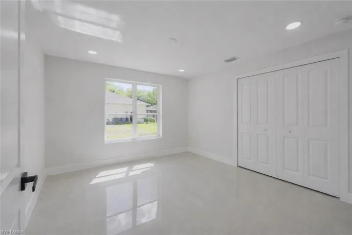 4529_Unfurnished bedroom featuring recessed lighting, a closet, and light tile patterned floors