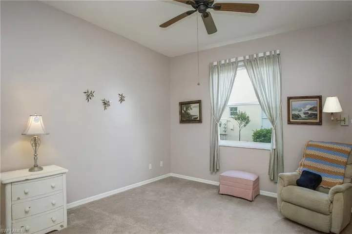 2nd Bedroom featuring ceiling fan and light carpet