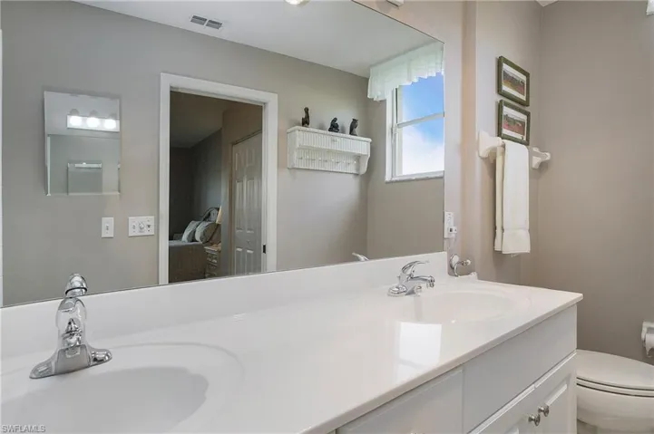 Primary Bathroom with toilet and vanity