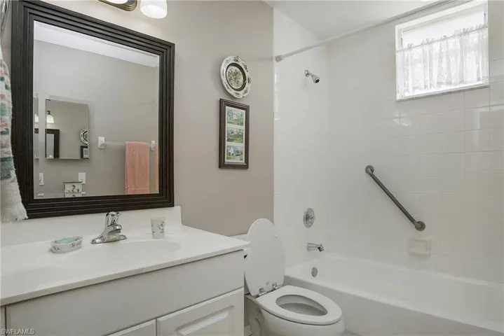 2nd Full bathroom featuring tiled shower / bath, vanity, and toilet