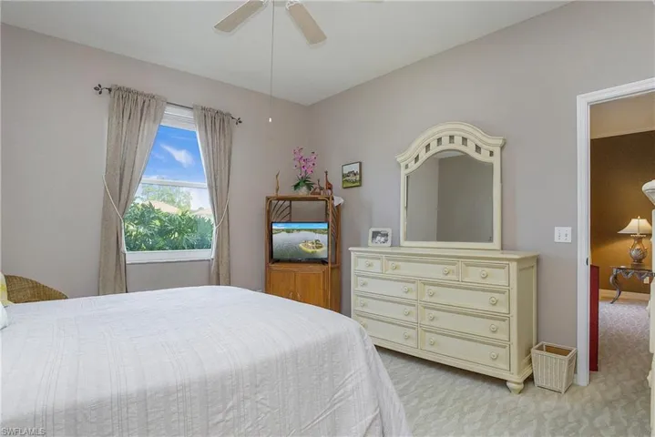 Primary Bedroom featuring ceiling fan