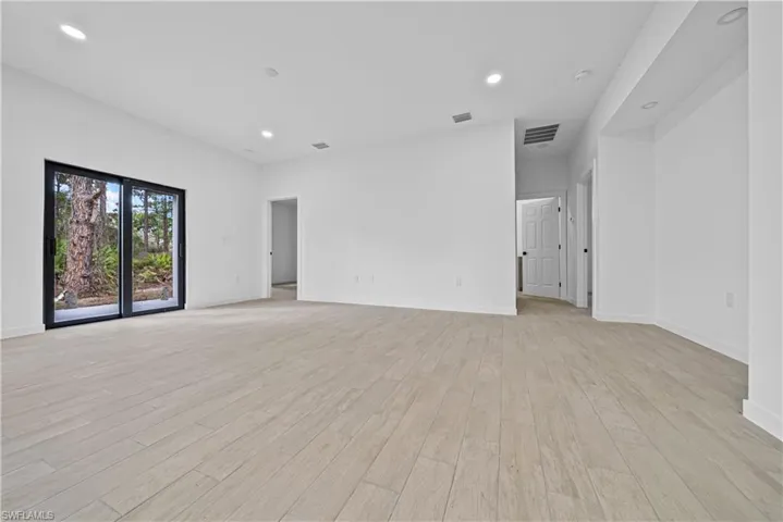 Spare room featuring recessed lighting and light wood-style flooring