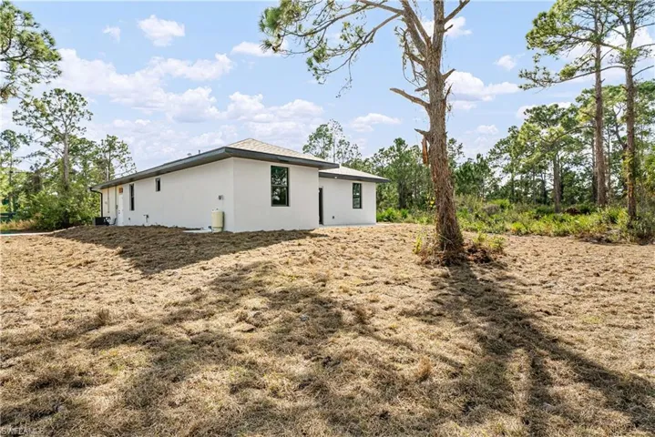 View of property exterior with stucco siding