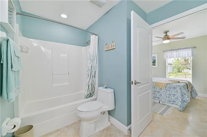 Guest bathroom featuring shower / bath combination