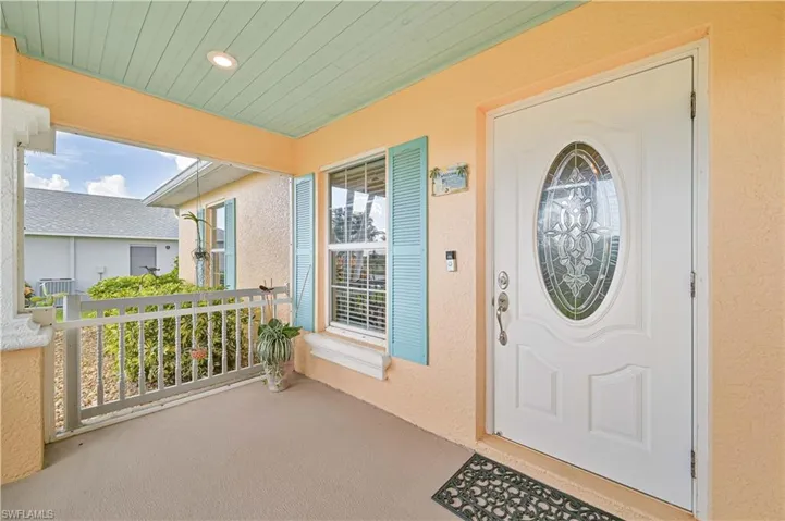 Property entrance with covered porch